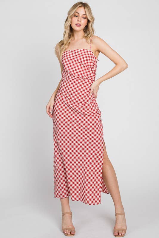 Woman wearing a red and white checkered dress on a white background
