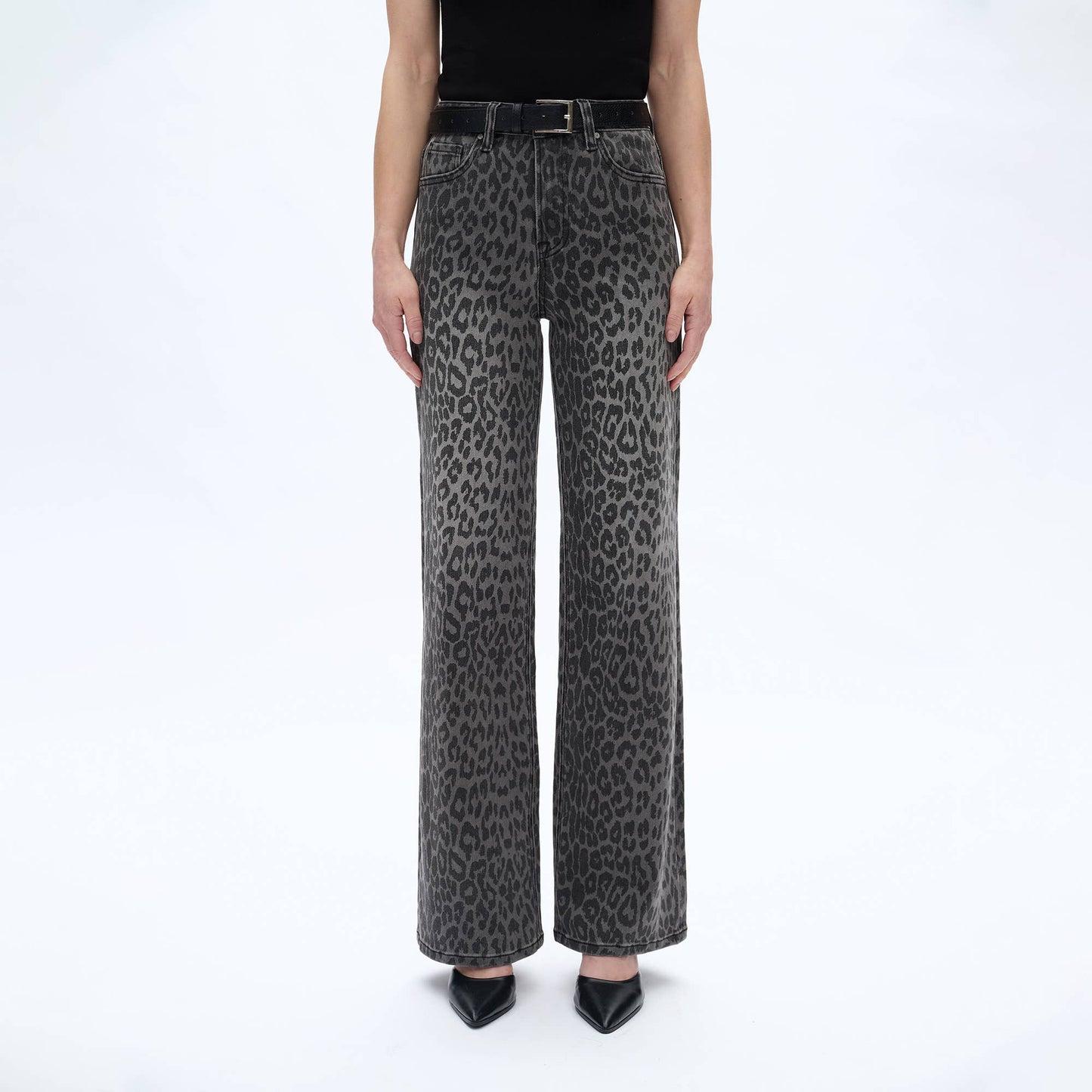 Leopard print jeans worn by a person on a white background