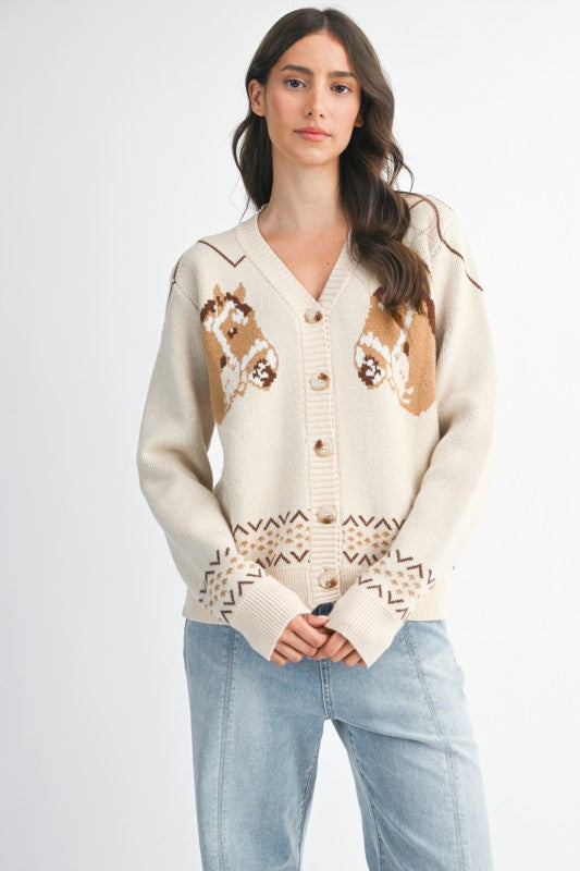 Woman wearing a cream cardigan with animal pattern on a white background