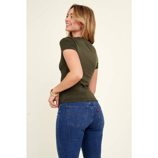 Olive green crew neck short sleeve fitted knit tee worn with blue jeans