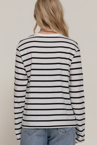 Women's white and black striped long sleeve round neck tee, back view