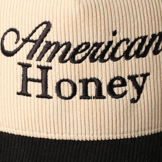 Cream and black two-tone corduroy trucker cap with American Honey embroidery