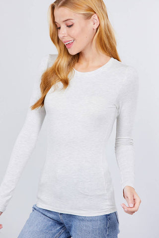 Women's white long sleeve crew neck fitted cotton jersey top with jeans