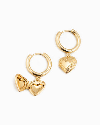 Sessori gold hoop earrings with openable heart locket charms, one shown open