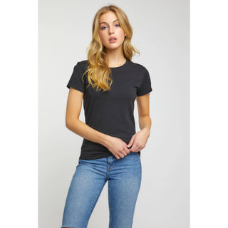 Women's black crew neck short sleeve fitted knit top paired with blue jeans