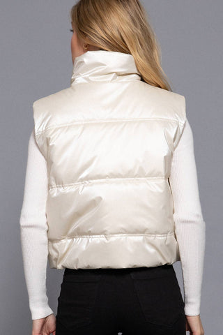 Cream shiny puffer vest with high neck and quilted panels, back view