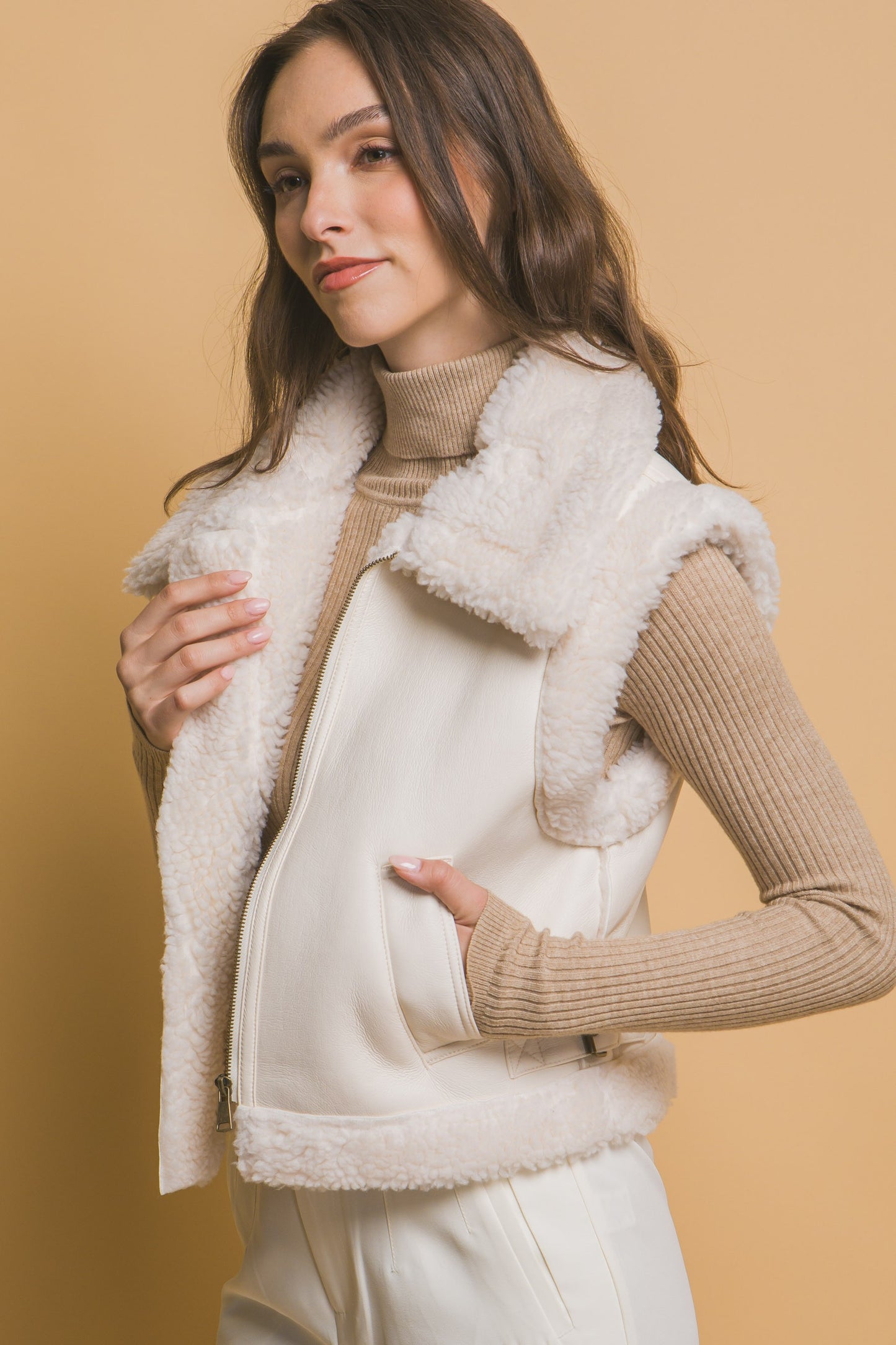 The Sloan Faux Leather Shearling Vest in Ivory