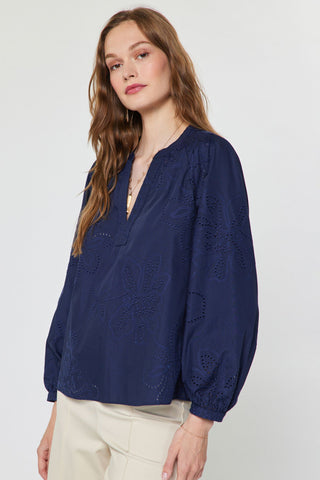 Navy blue long sleeve eyelet embroidered floral blouse with V-neckline