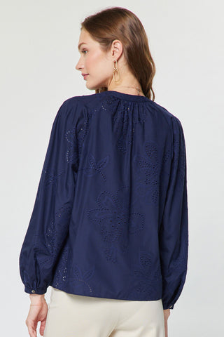 Navy blue long sleeve blouse with floral eyelet embroidery and gathered neckline