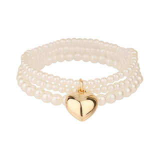 Ellison+Young three-strand white pearl stretch bracelet set with gold puffy heart charm