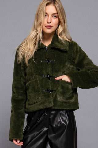 Olive green faux fur duffle jacket with black toggle buttons and front pockets