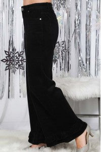 Black corduroy wide-leg pants with ruffle hem detail, full length