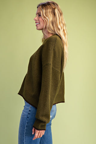Gigio olive green knit pullover sweater with ribbed cuffs and hem, side view