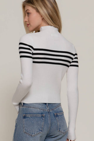 White ribbed mock neck sweater with black horizontal stripes, long sleeves