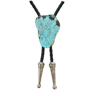 Turquoise gemstone bolo tie with black braided cord and silver engraved tips