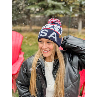 Navy blue USA knit pom beanie with stars and red white accents