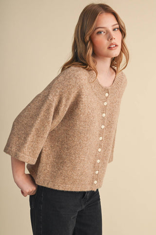 Tan heathered knit cardigan with elbow sleeves and cream buttons, cropped fit