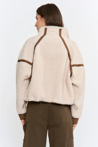 Cream sherpa jacket with brown trim details, shown from the back