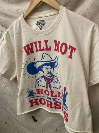 White cropped tee with cowboy graphic and I Will Not Hold My Horses text