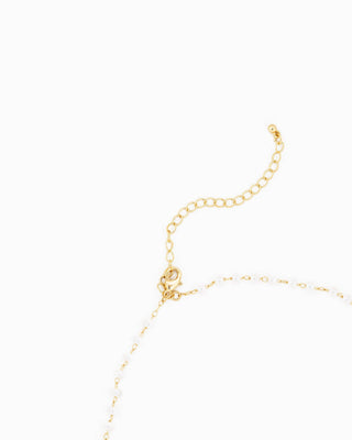 Gold lobster clasp extender chain with white pearl and gold chain detail