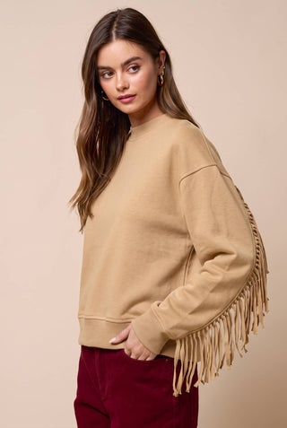 Lalavon tan crew neck sweatshirt with fringe detail along sleeves and sides