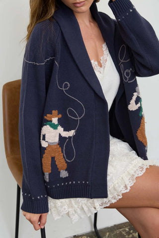 Navy knit cardigan with cowboy lasso jacquard pattern and shawl collar
