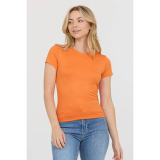 Women's orange crew neck short sleeve fitted knit tee with blue jeans
