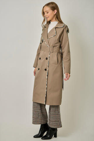 Taupe double-breasted midi trench coat with plaid trim, belt, and dark buttons