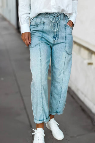 Light wash high-waist wide-leg drawstring jeans with rolled cuffs and front pockets