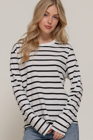 White long sleeve crew neck tee with black horizontal stripes and ribbed cuffs