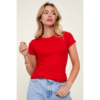 Women's red crew neck short sleeve fitted knit tee with light wash jeans