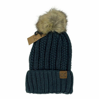 Dark teal cable knit CC beanie with tan faux fur pom pom and cuffed brim