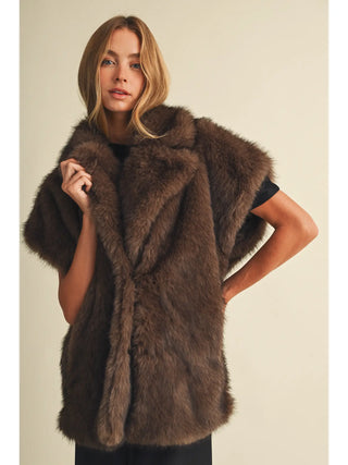 Cappuccino brown faux fur vest with lapel collar and short sleeves on model