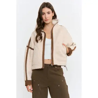 Cream sherpa zip-up jacket with brown contrast trim and collar detailing