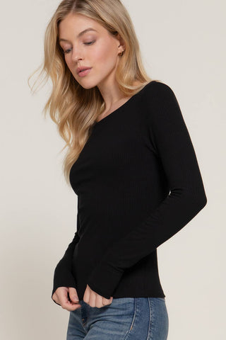 Black ribbed long sleeve round neck fitted tee worn with blue jeans