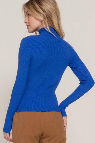 Royal blue ribbed knit turtleneck sweater with long sleeves, back view