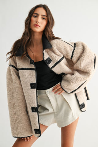 Camellia Toni reversible sherpa jacket in cream with black leather trim and toggle closures