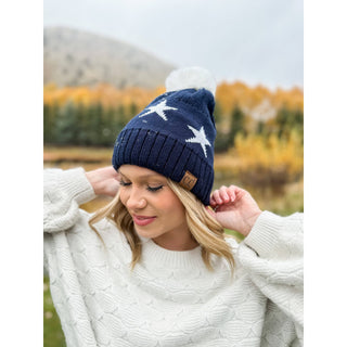 Navy knit beanie with white star print and white pom pom by C.C Beanie
