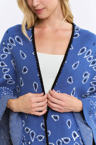 Blue open-front bandana print kimono cardigan with black trim and white lining