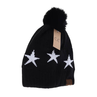 Black knit C.C beanie with white stars, black faux fur pom-pom on top