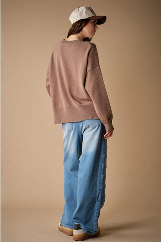 Oversized mocha knit crewneck sweater with ribbed hem, back view