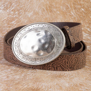Brown vegan leather belt with floral embossing and oval hammered silver western buckle