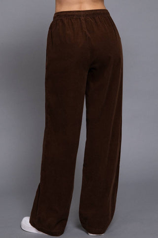 Brown corduroy wide-leg pants with elastic waistband, back view
