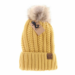 Mustard yellow cable knit CC beanie with faux fur pom pom and cuffed brim