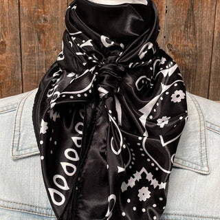 Black satin wild rag with white paisley print tied around mannequin neck