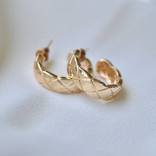 Chunky gold-tone hoop earrings with quilted crosshatch etched pattern and post back