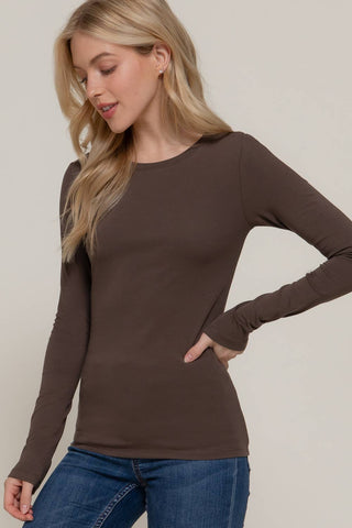 Women's brown long sleeve crew neck fitted cotton jersey top with jeans