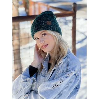 Teal confetti boucle knit cuff beanie with CC brand patch worn by blonde woman
