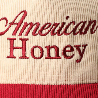 Cream and red corduroy trucker cap with embroidered American Honey script