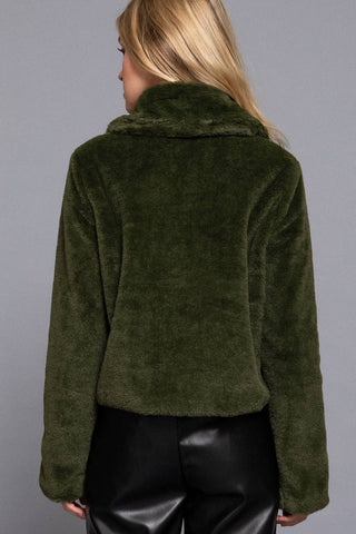 Olive green faux fur cropped jacket with collar, back view, black leather pants